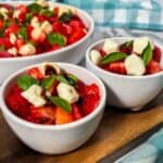 Watermelon strawberry caprese salad with mozzarella.