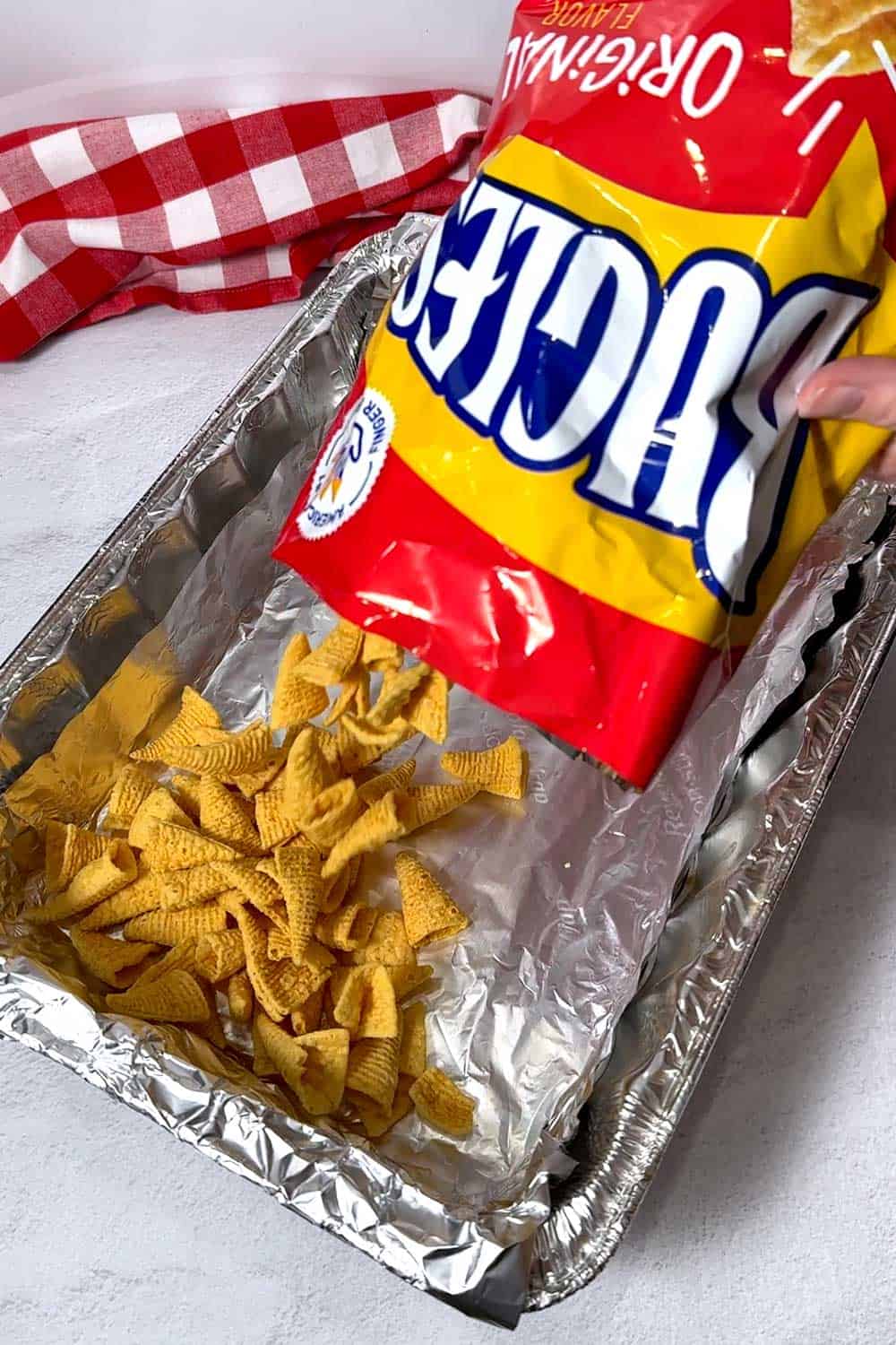 Adding Bugles to a disposable aluminum pan lined iwith nonsticl aluminum foil.