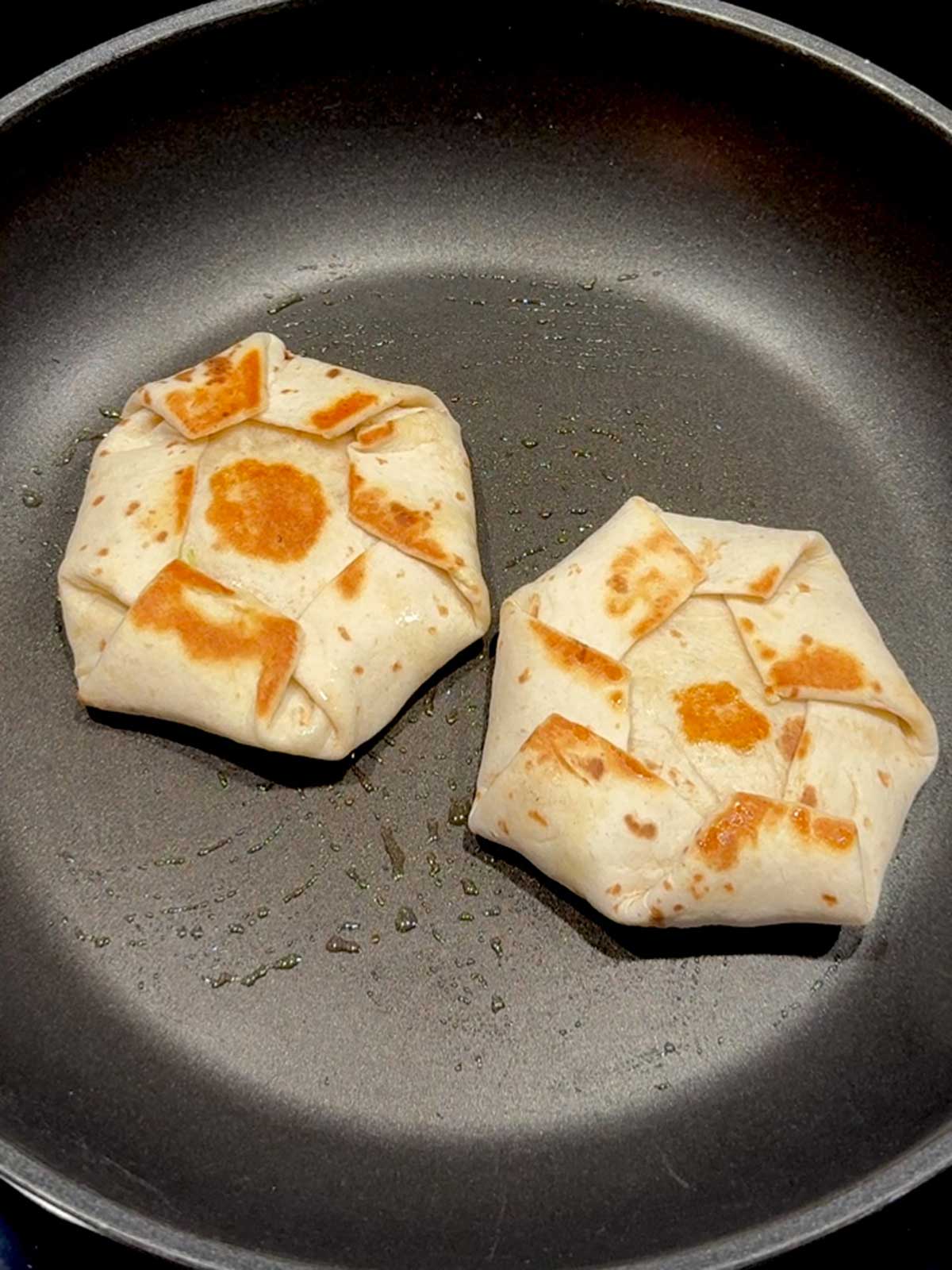 Cooking the crunchwrap sliders.