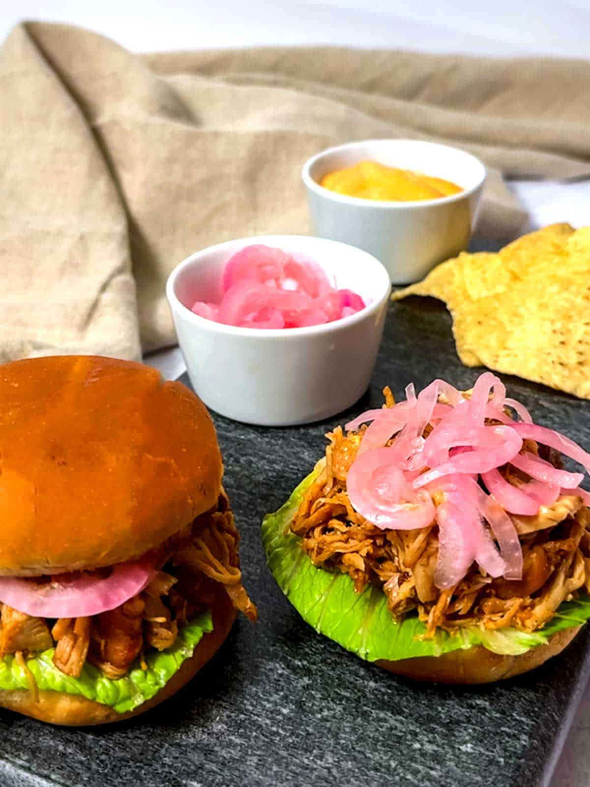 Honey chipotle chicken sliders with onions.