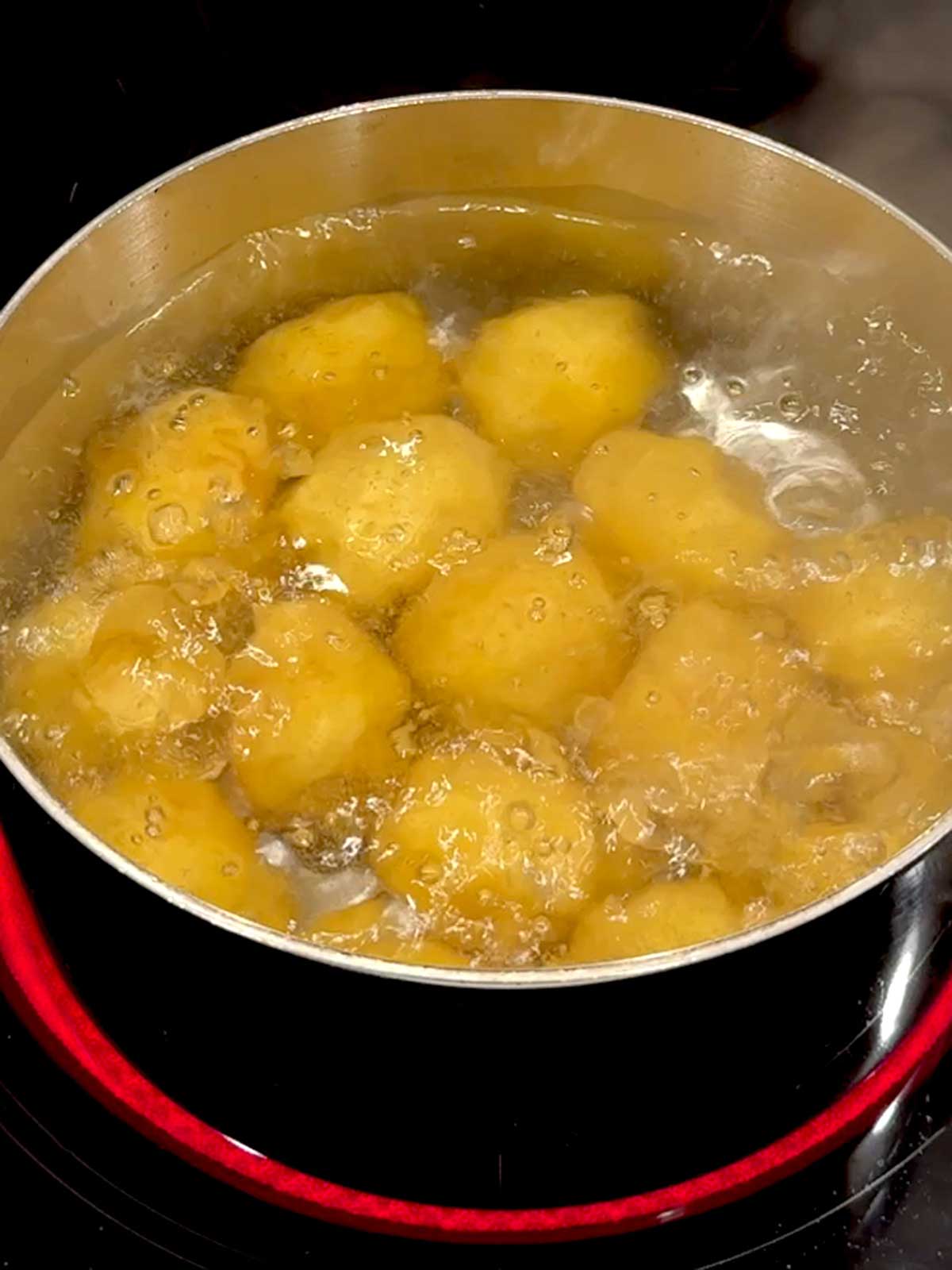 Boiling the baby gold potatoes.