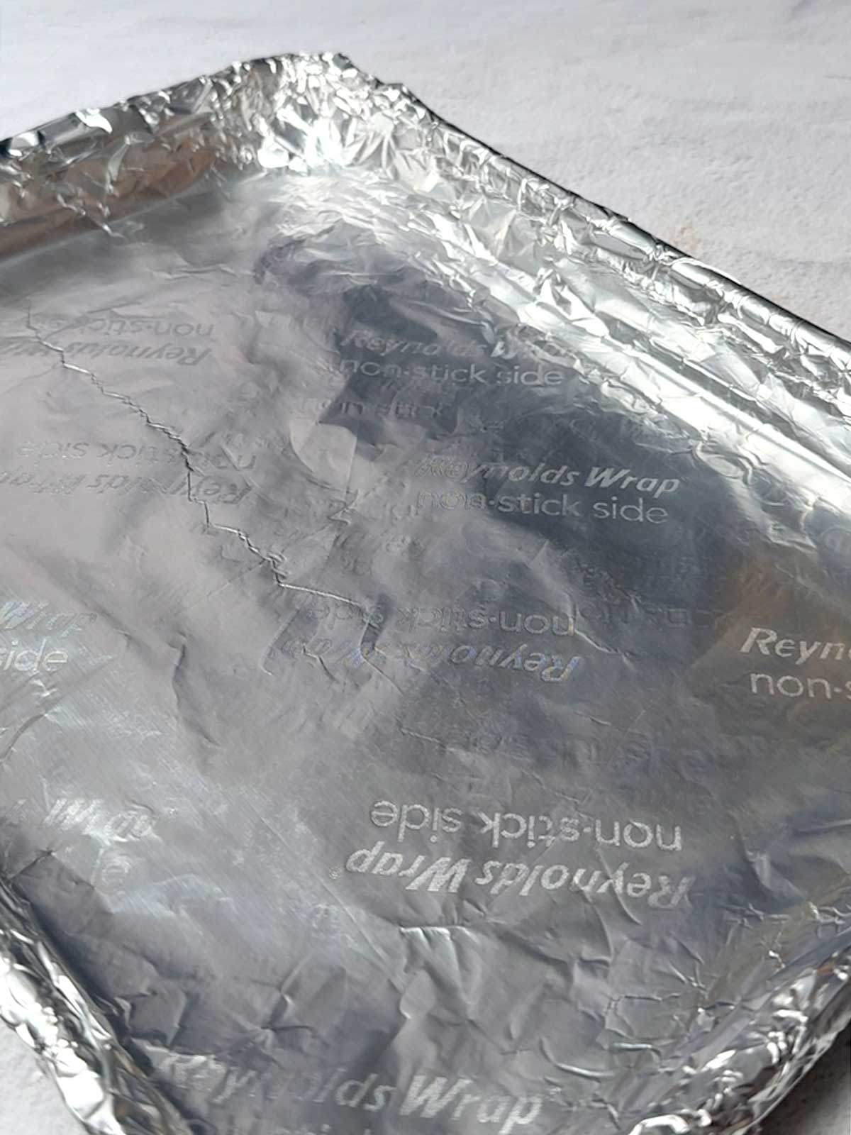 Quarter sheet pan lined with nonstick aluminum foil.