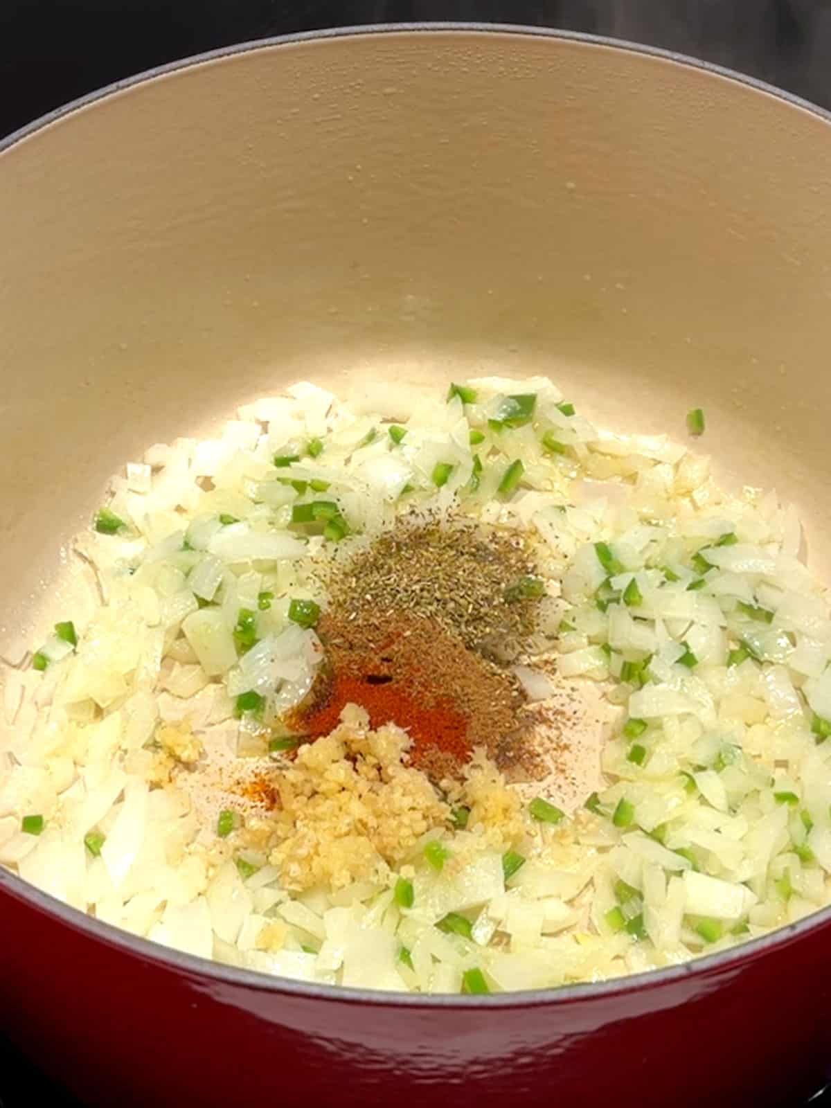 Cooking the aromatics in a Dutch oven.