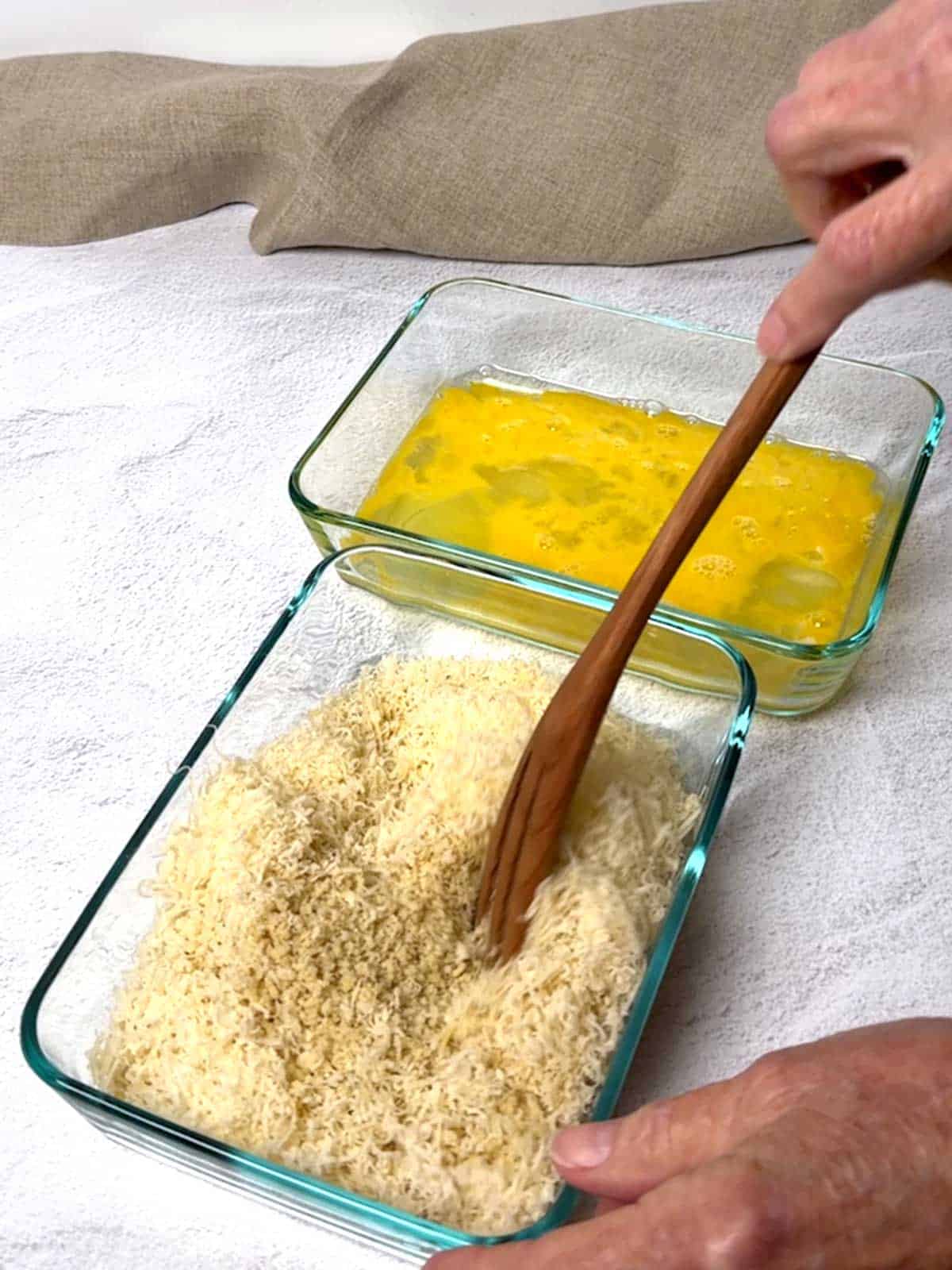 Combining the Panko and Parmesan cheese.