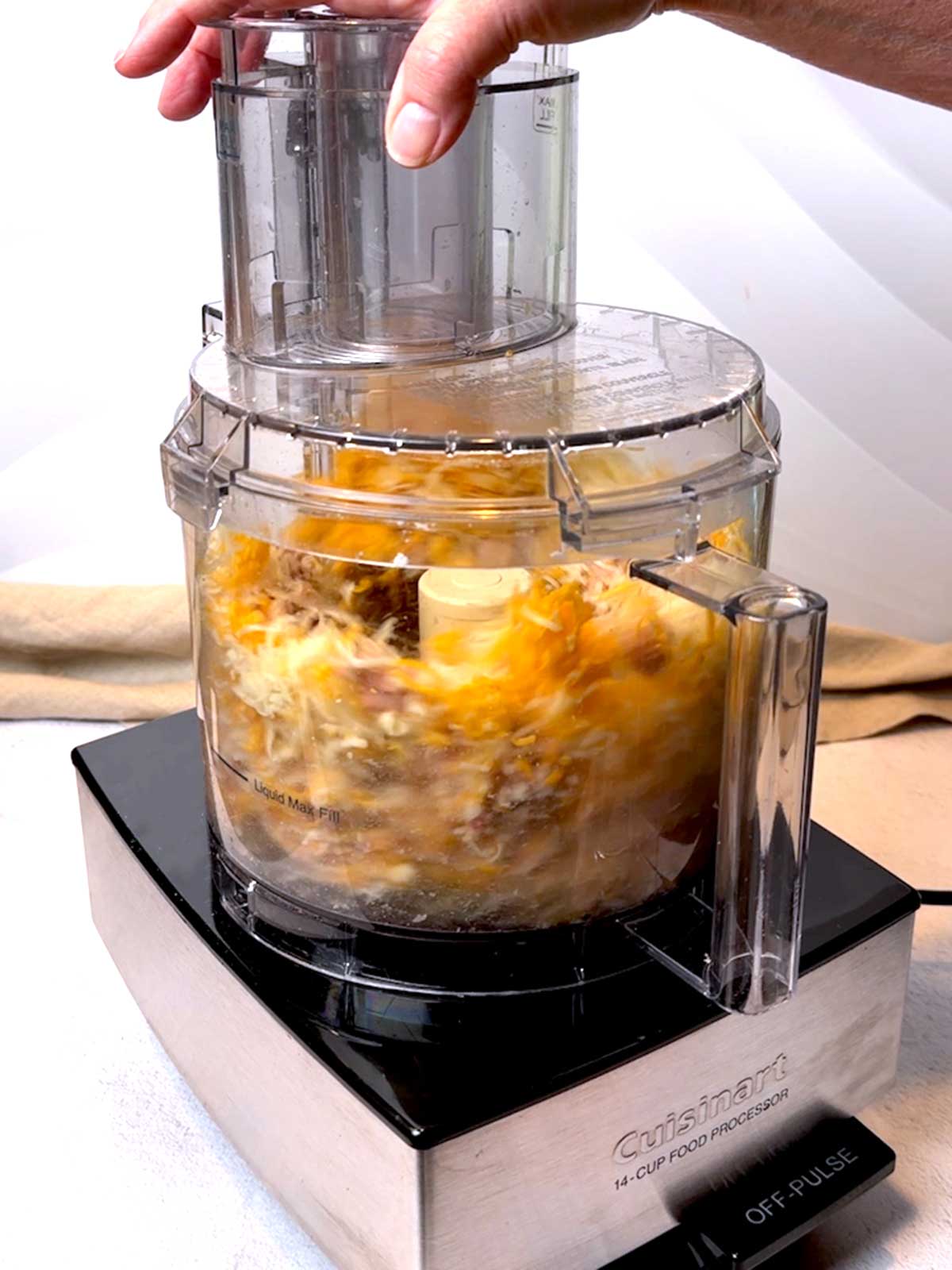 Processing cheese in food processor.