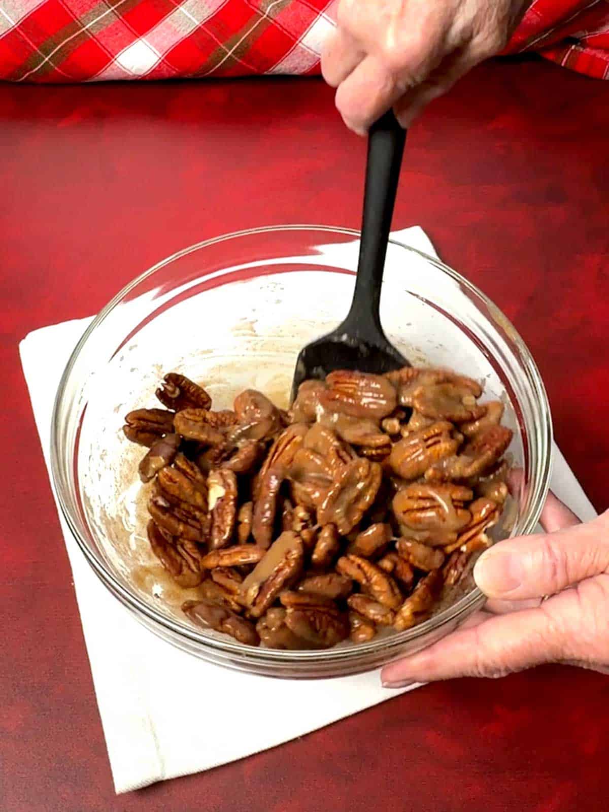 Stirring the pecans.