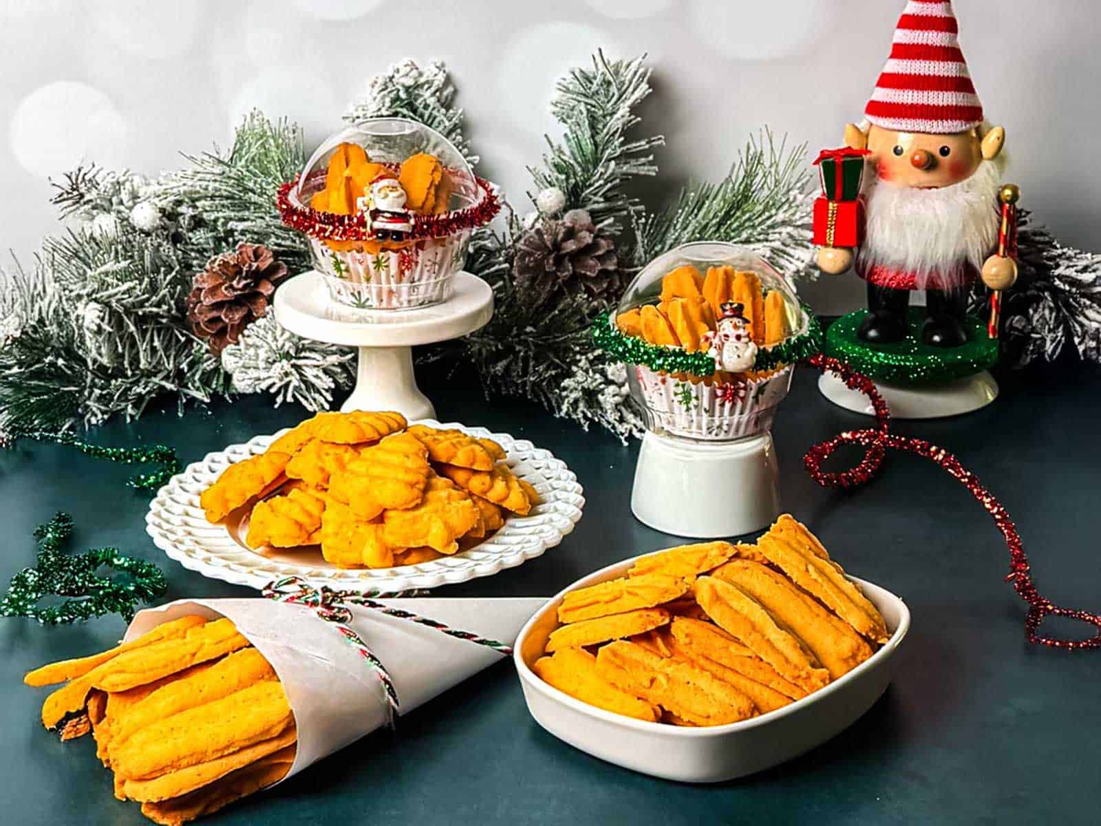 Southern cheese straws stacked vertically on a serving board