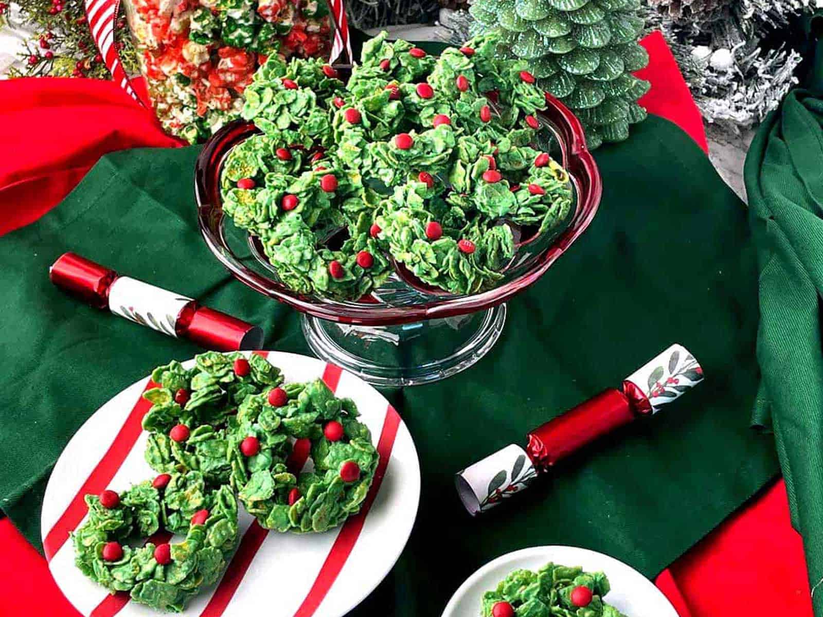Christmas corn flake wreath cookies with red candies on a tray