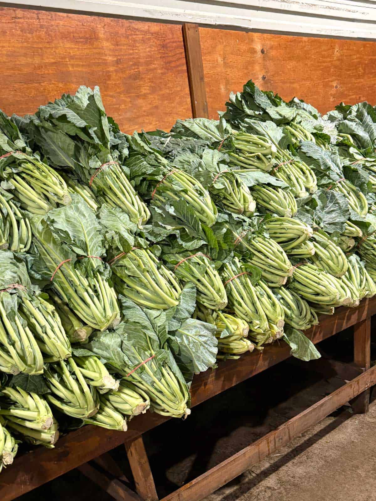 Collard greens piled up at the farmers' market.