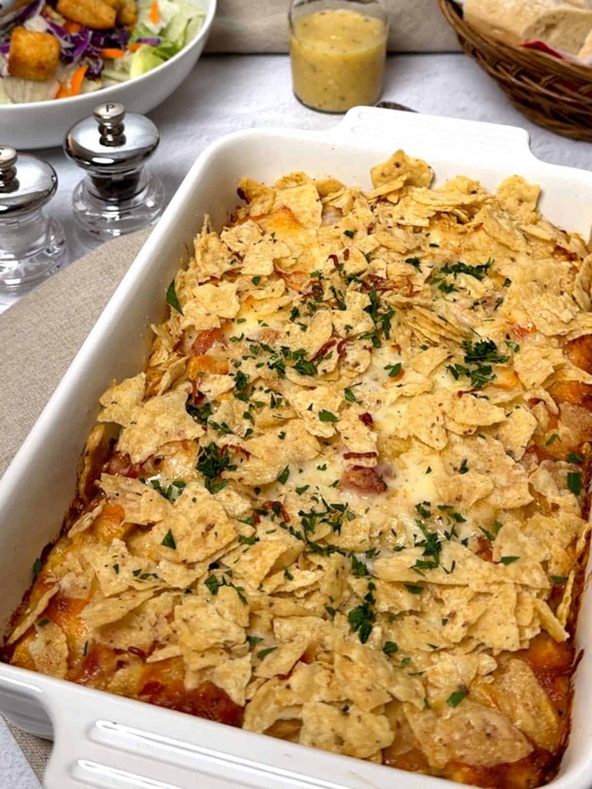 Reimagined King Ranch Casserole garnished with minced parsley and ready to eat.