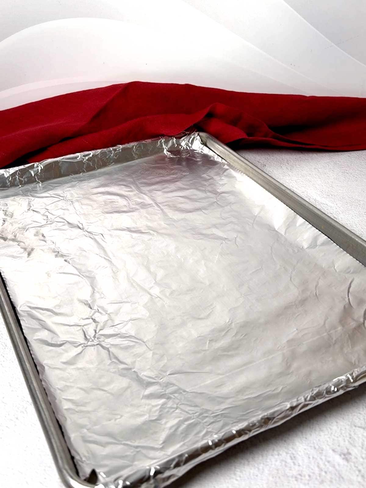 Half-sheet baking pan lined with nonstick alumimum foil.