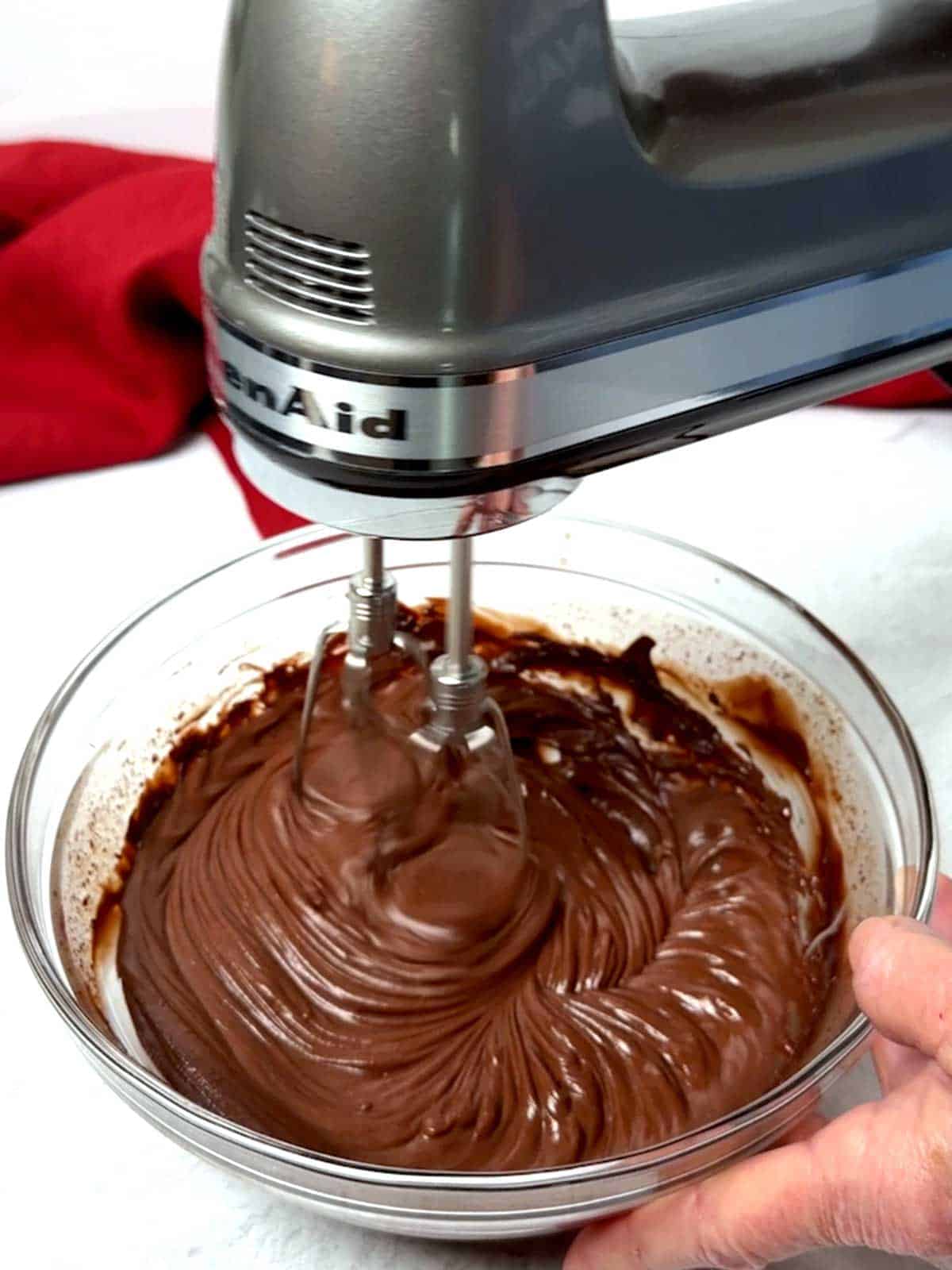 Beating the chocolate ganache.