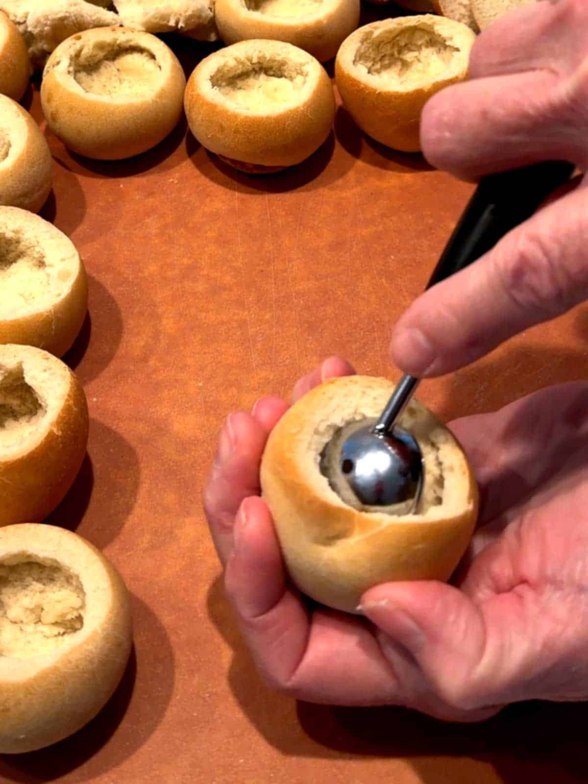 Using the larger end of a melon baller to cut around the inside of the rolld.