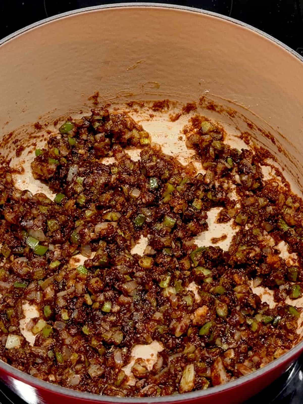 Onoins, bell pepper, and celery cooked in the roux.