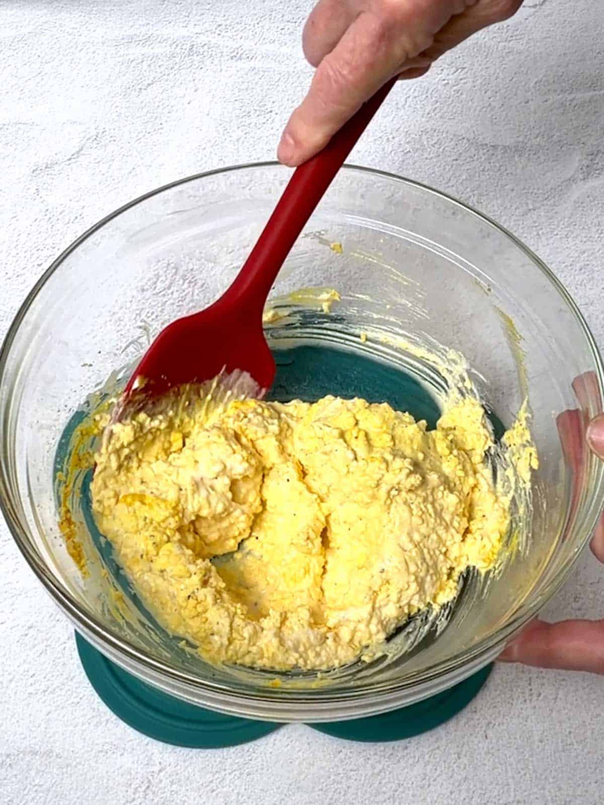 Stirring the egg yolk mixture.