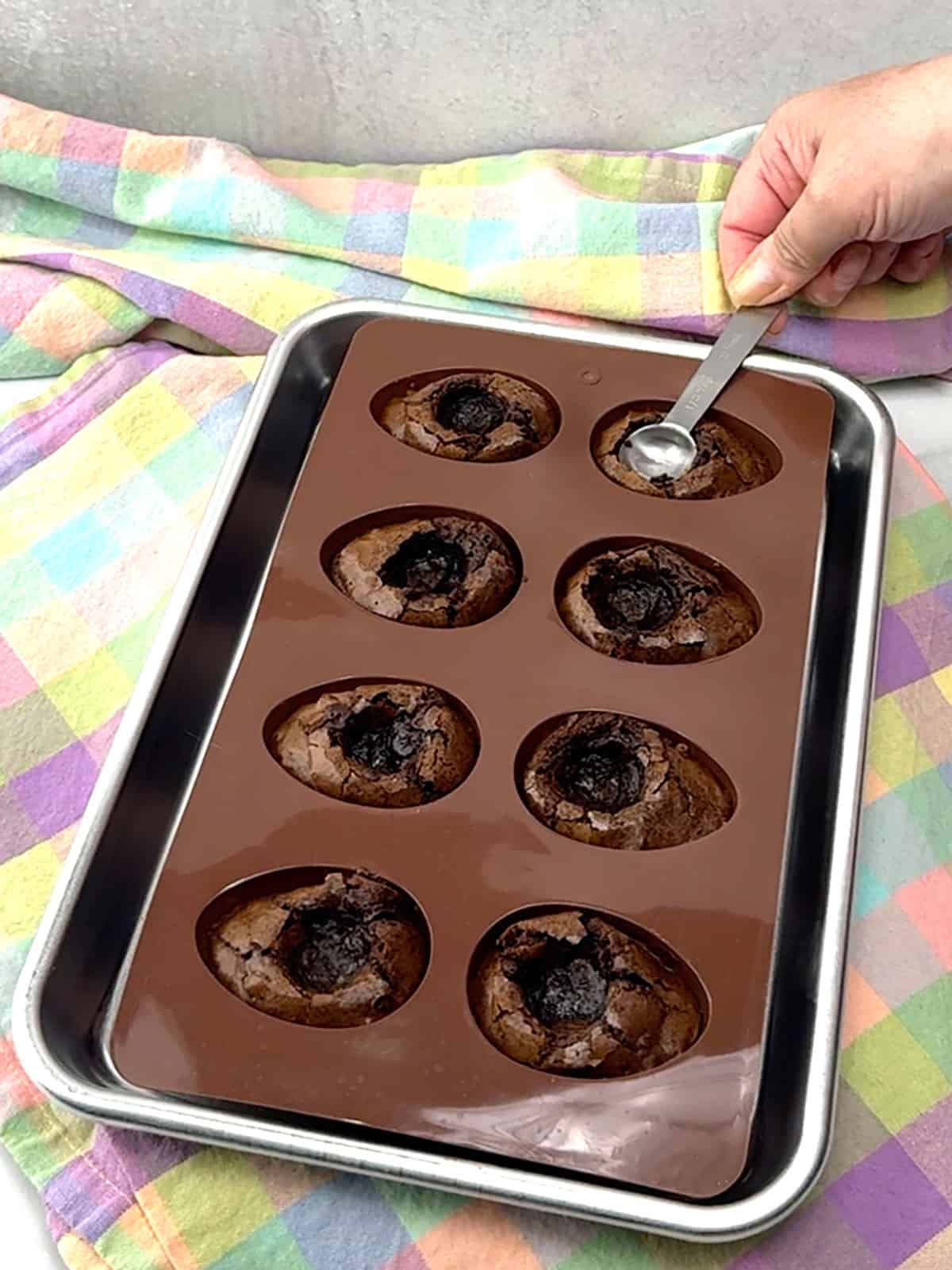 re-pressing indentation in each egg