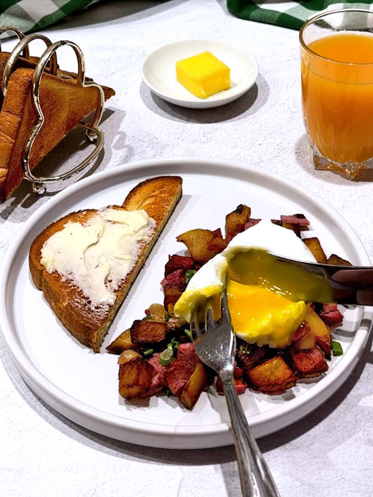 Corned beef hash for breakfast with a poached egg.