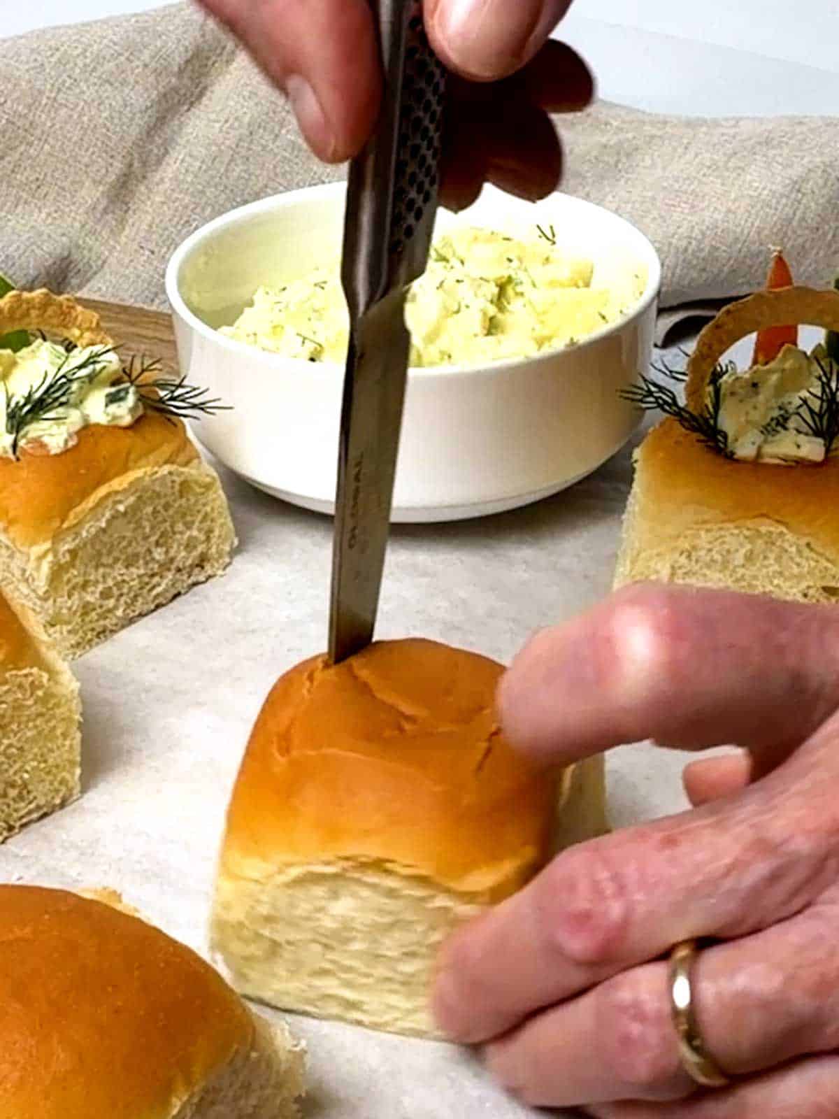 Cutting the top of the roll to form a cavity.