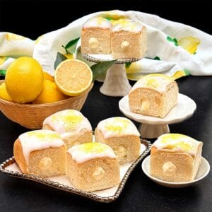 Lemon-curd filled hawaiian rolls with glossy glaze.