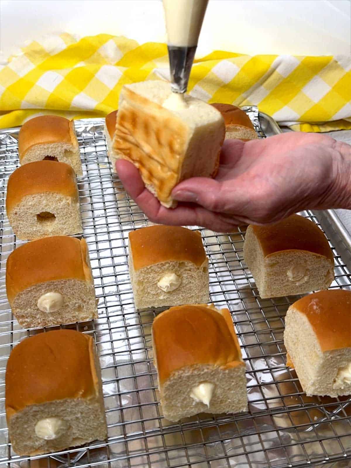 Filling the rolls with lemon-curd filling.