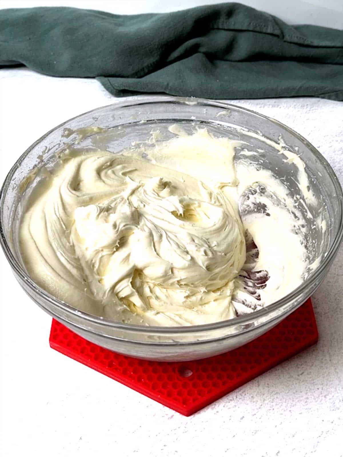 Cream cheese frosting in a bowl.