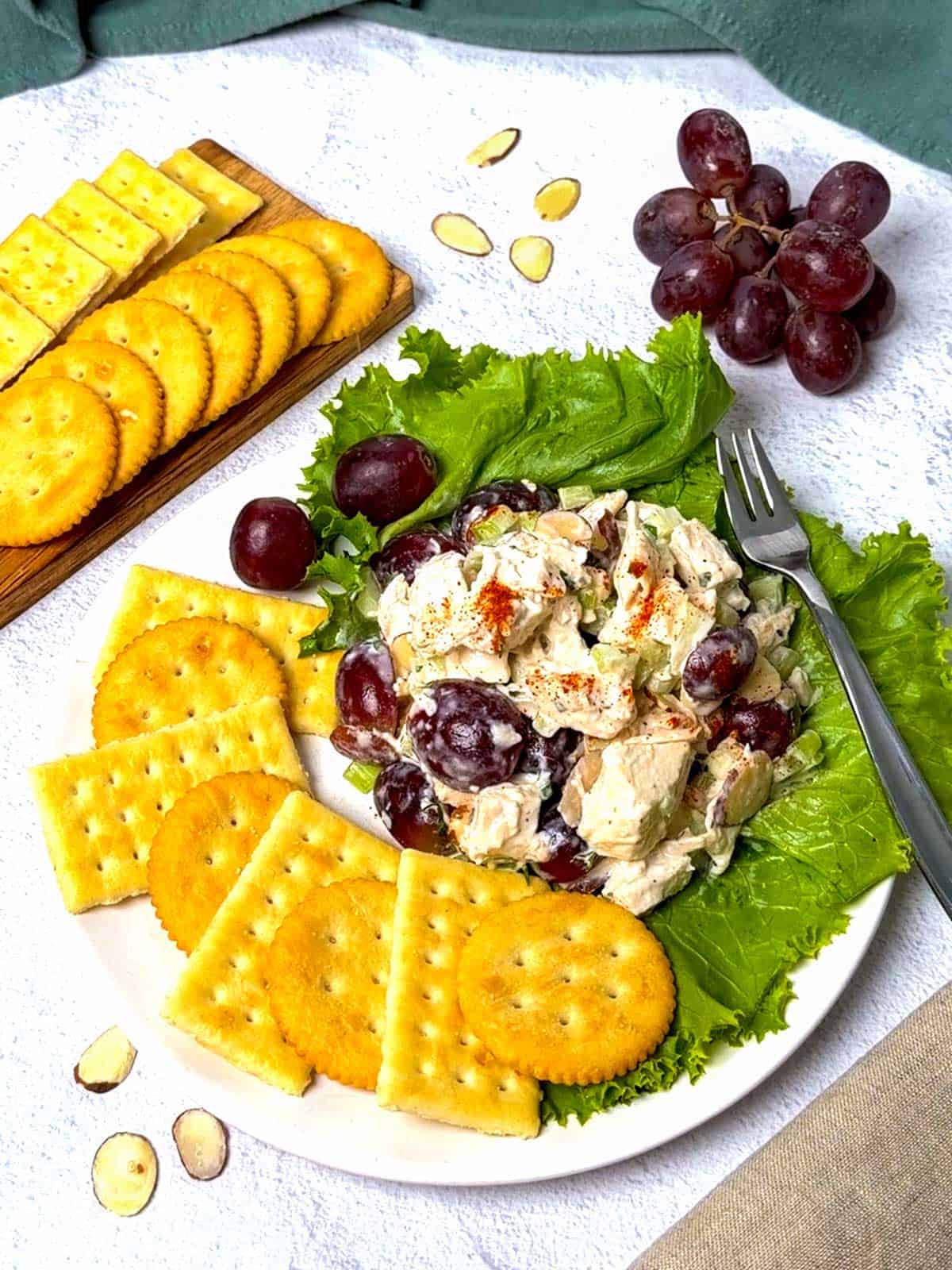 Neiman Marcus-Style Chicken Salad served with grapes and crackers.