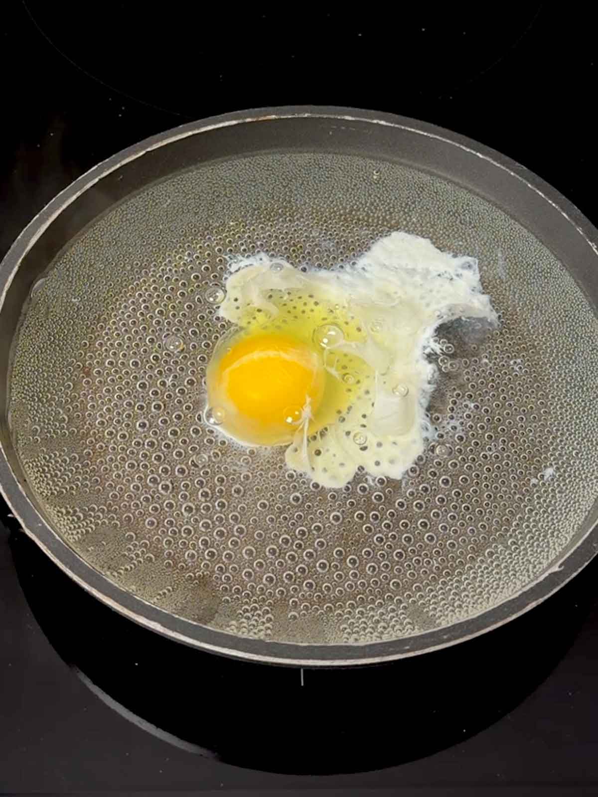 Egg that has not been drained in the pan.