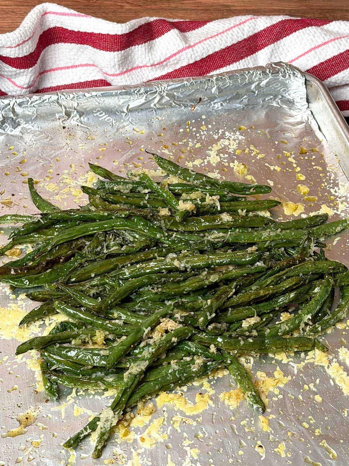 Green beans out of oven with Parmesan cheese.