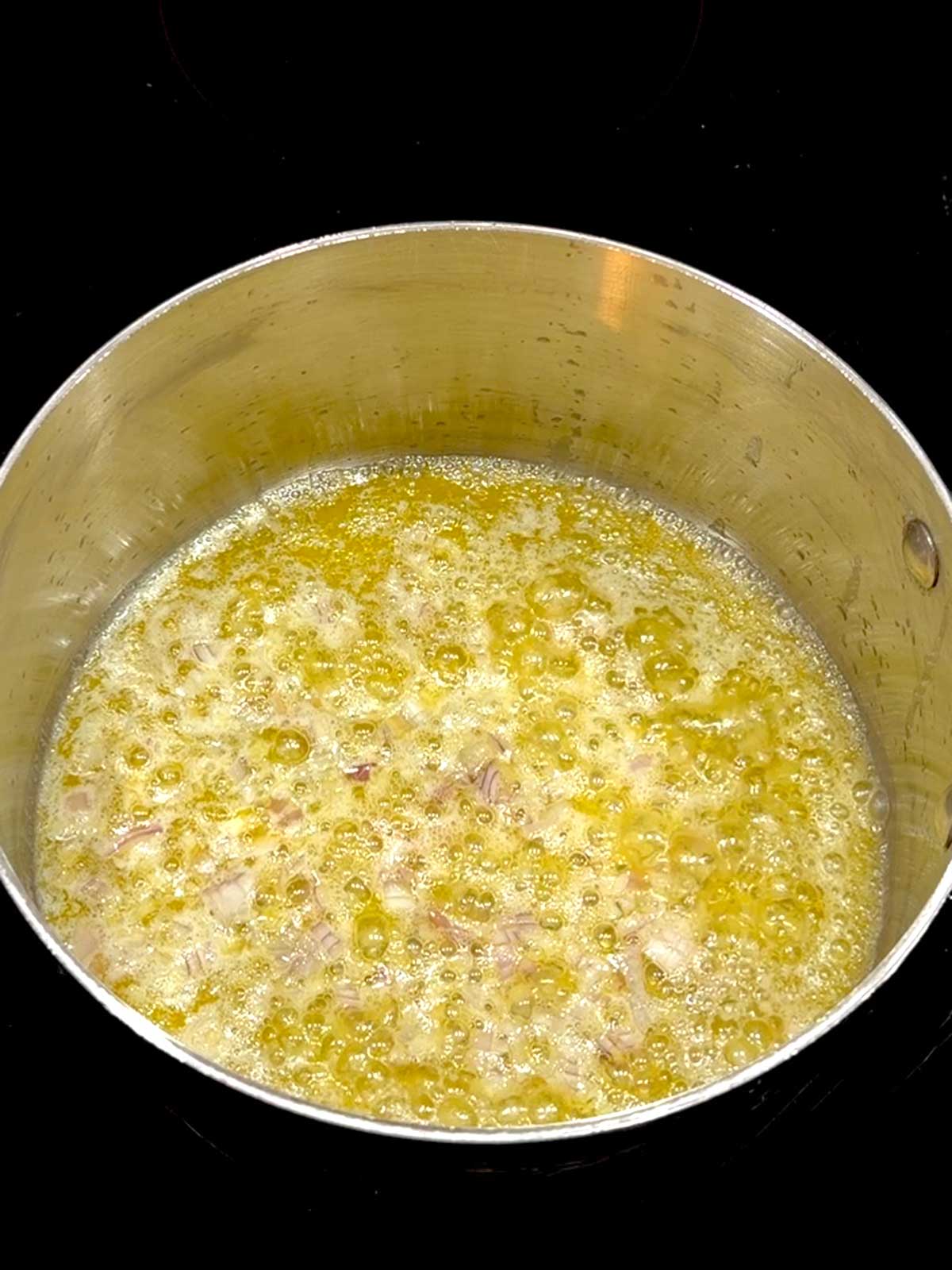 Shallots sautéeing in butter.