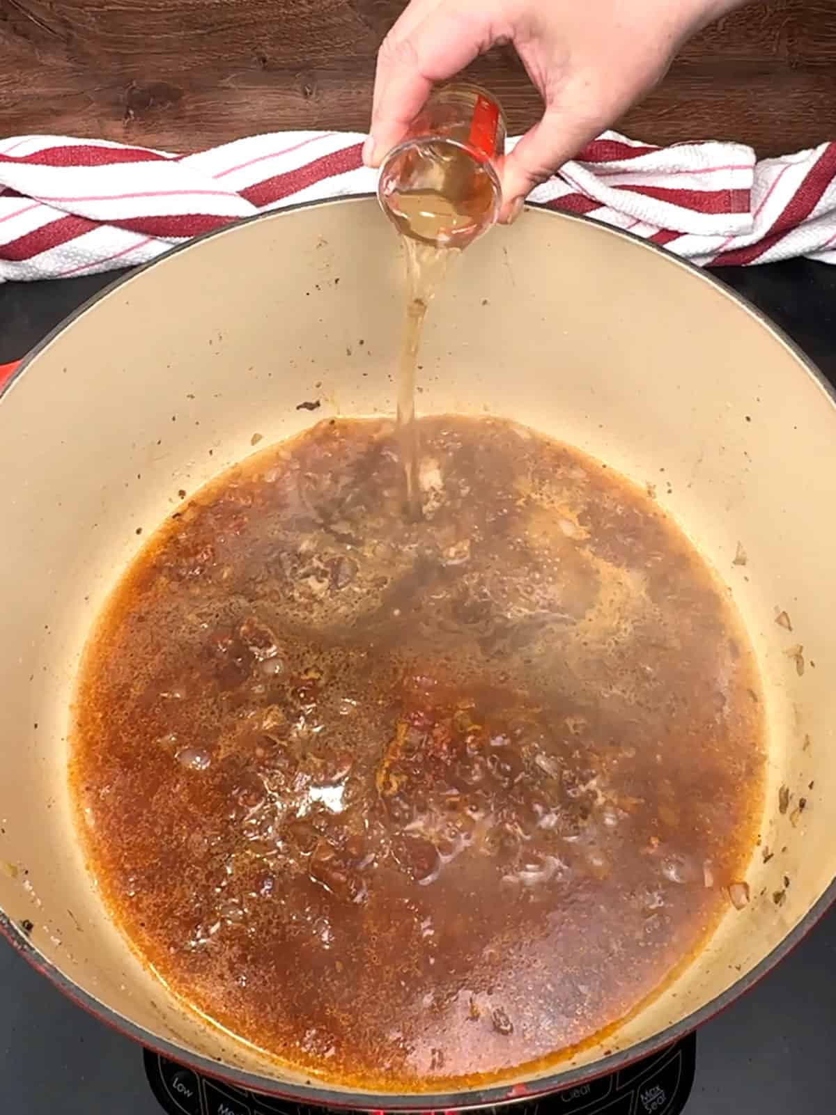 adding beef broth and apple cider vinegar