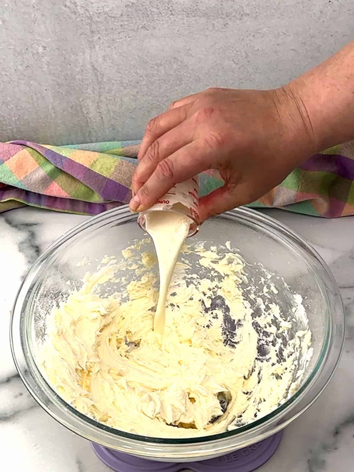 adding vanilla and heavy whipping cream for frosting