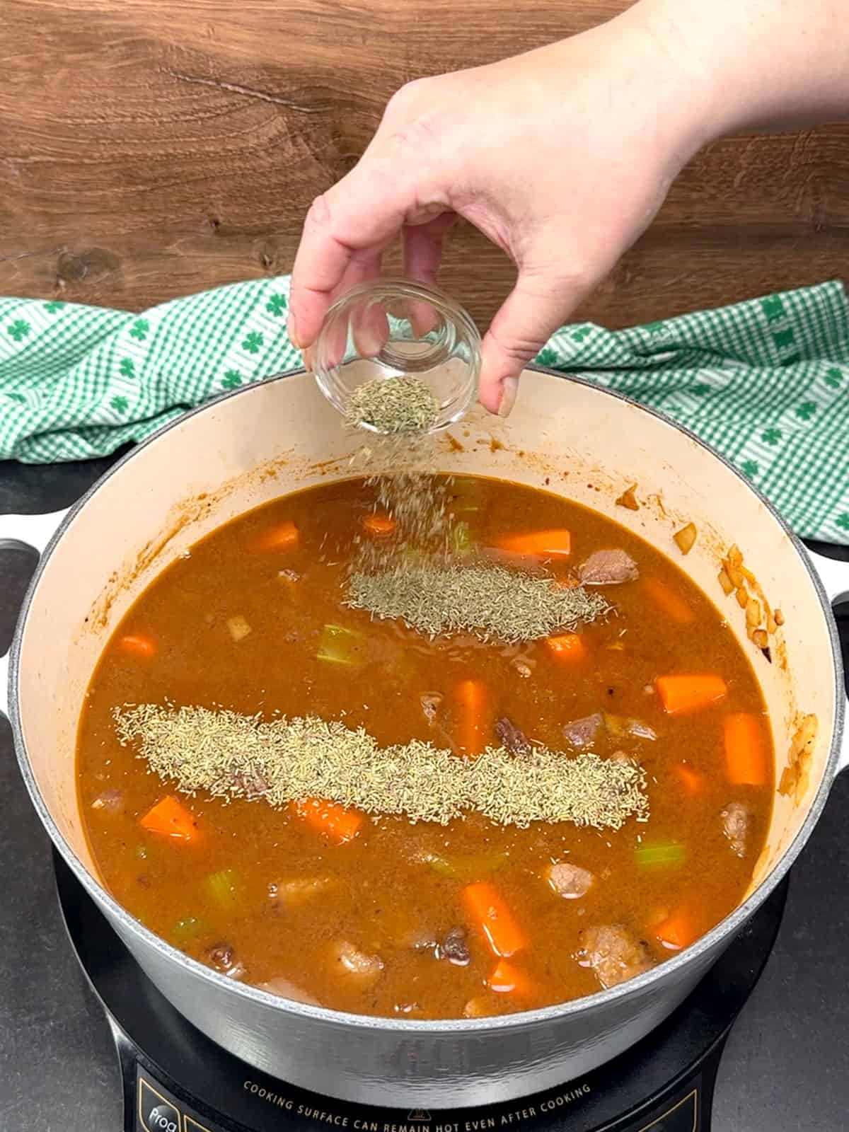 adding Worcestershire sauce, brown sugar, thyme and rosemary