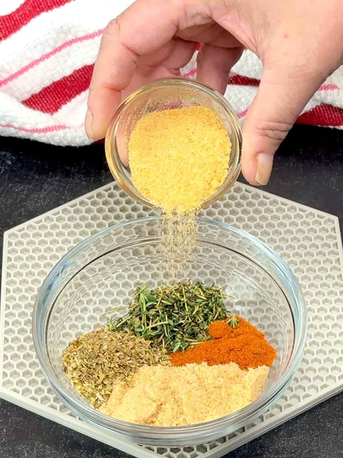 combining herbs for the rub in a small bowl