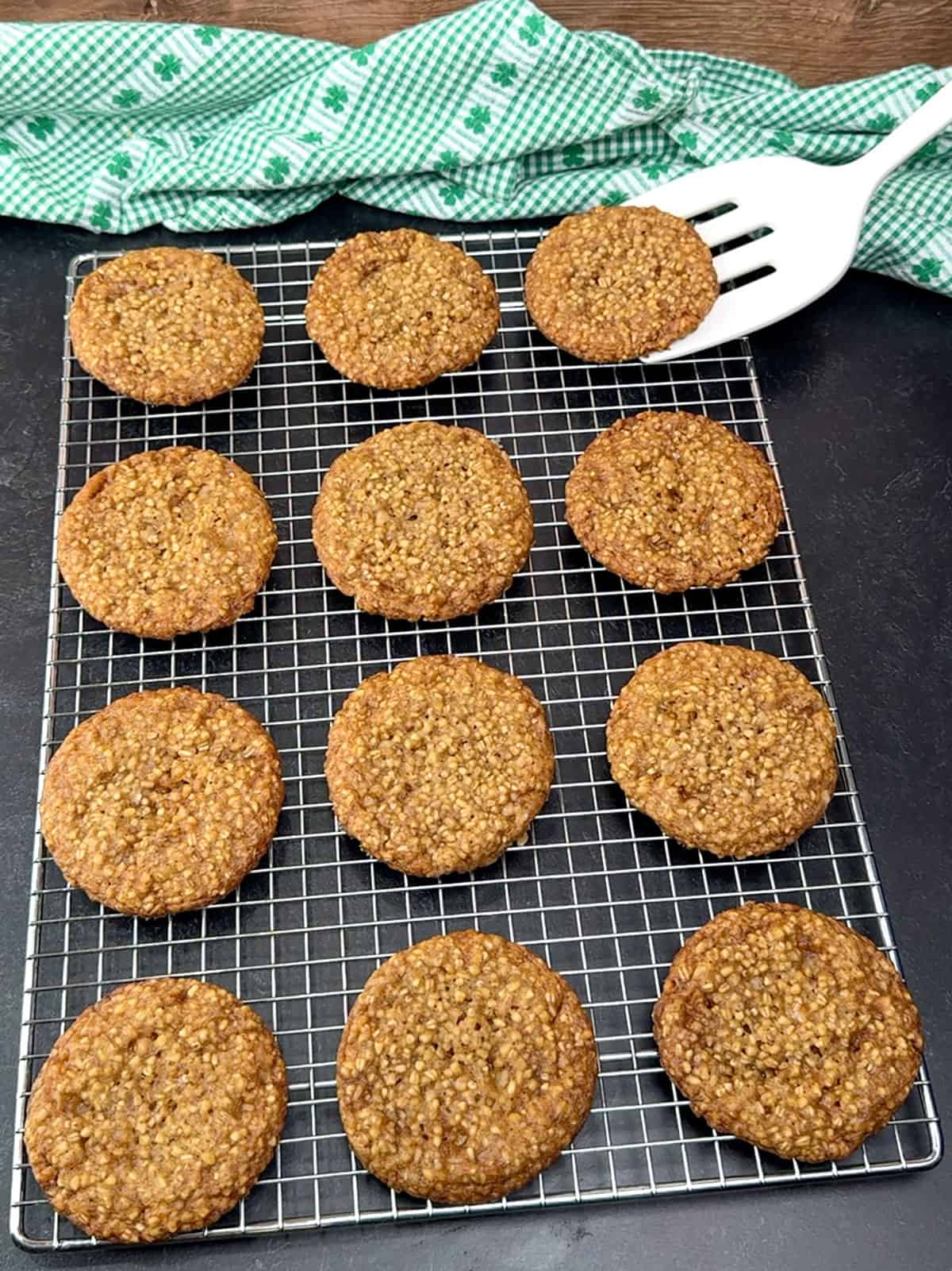 transferring Irish steel-cut oatmeal cookies into a wire cooling rack