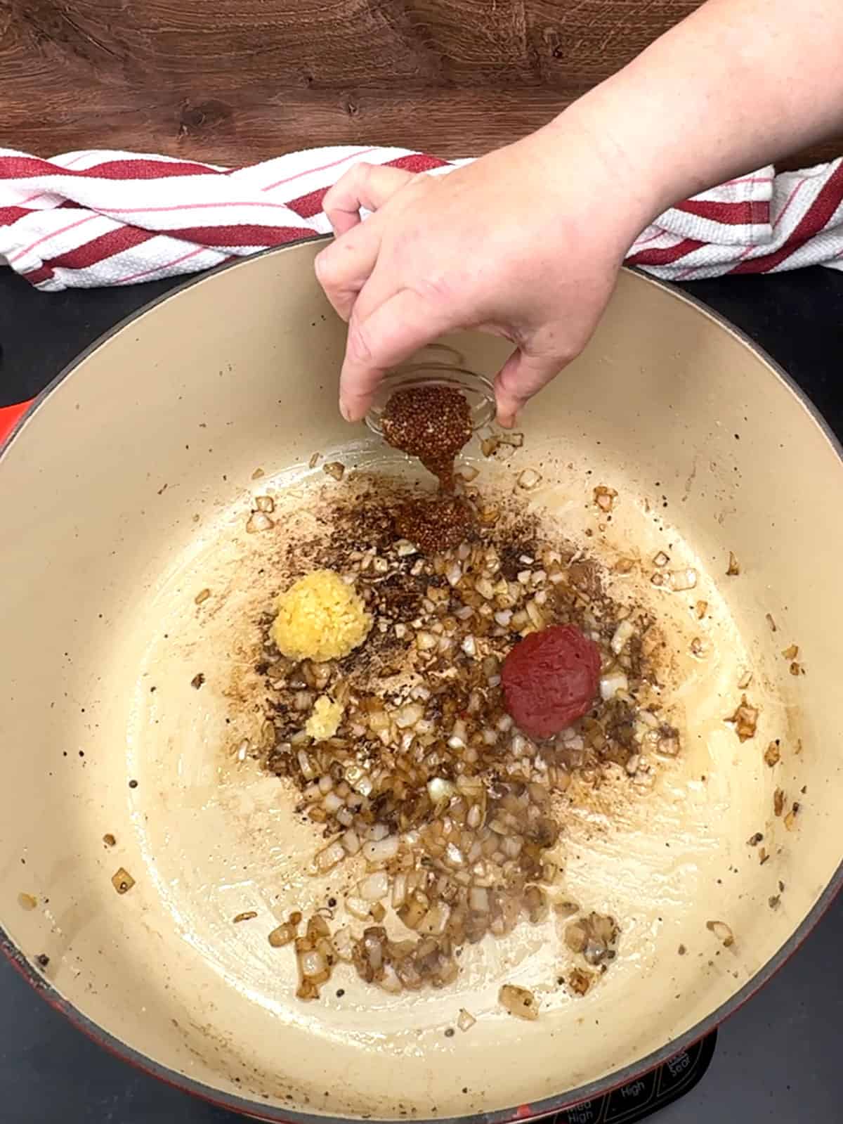 sautéing onions, garlic tomato paste, and whole ground mustard