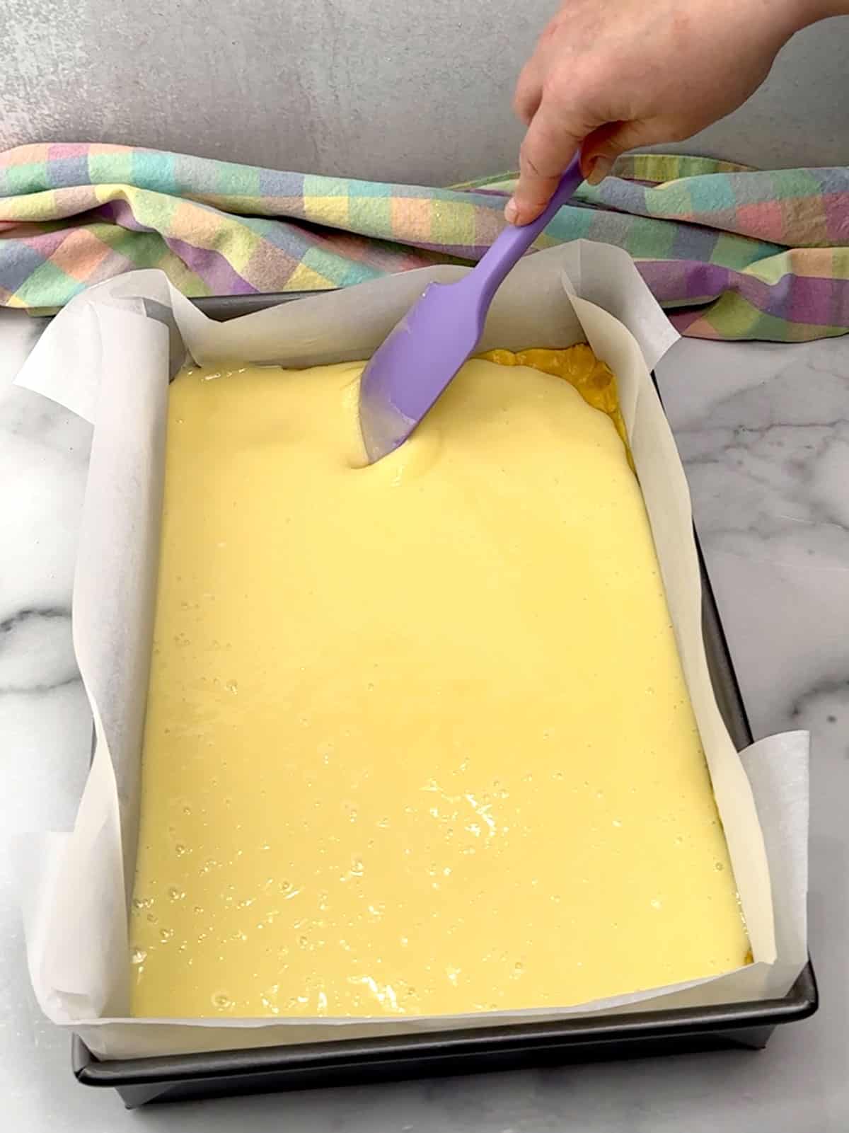spreading cream cheese mixture into an even layer