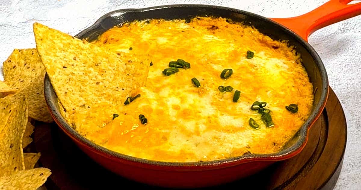 Cheesy Chipotle Chicken Dip with tortilla chips.