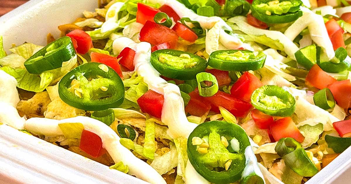 Taco noodle casserole topped with your favorite condiments.
