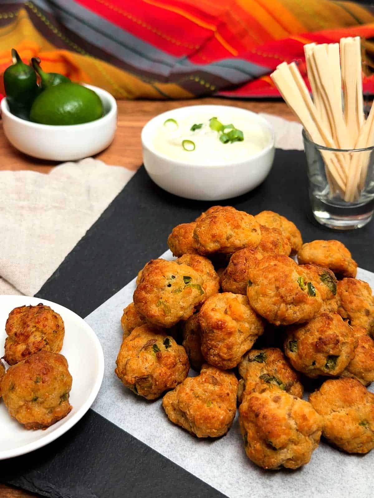 Jalapeno popper sausage balls with dipping sauce.
