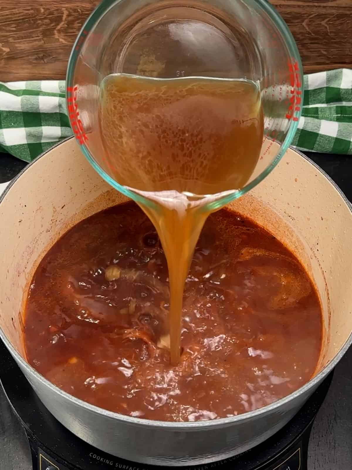 adding beef broth