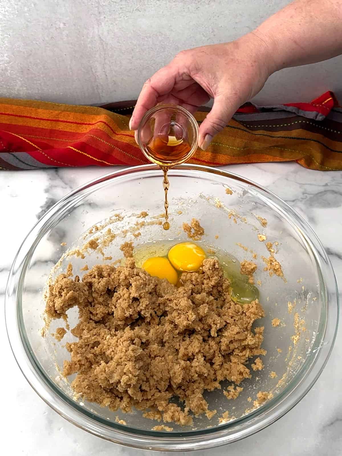 adding eggs and vanilla extract