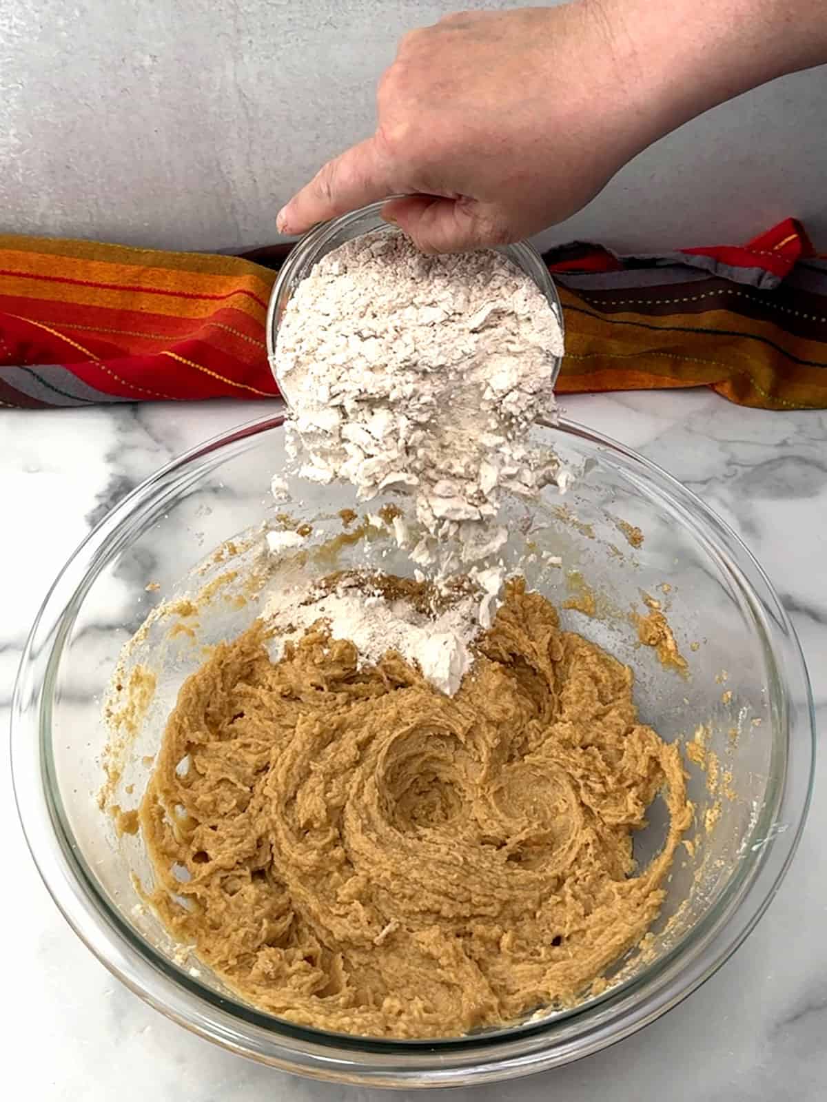 adding flour mixture to batter