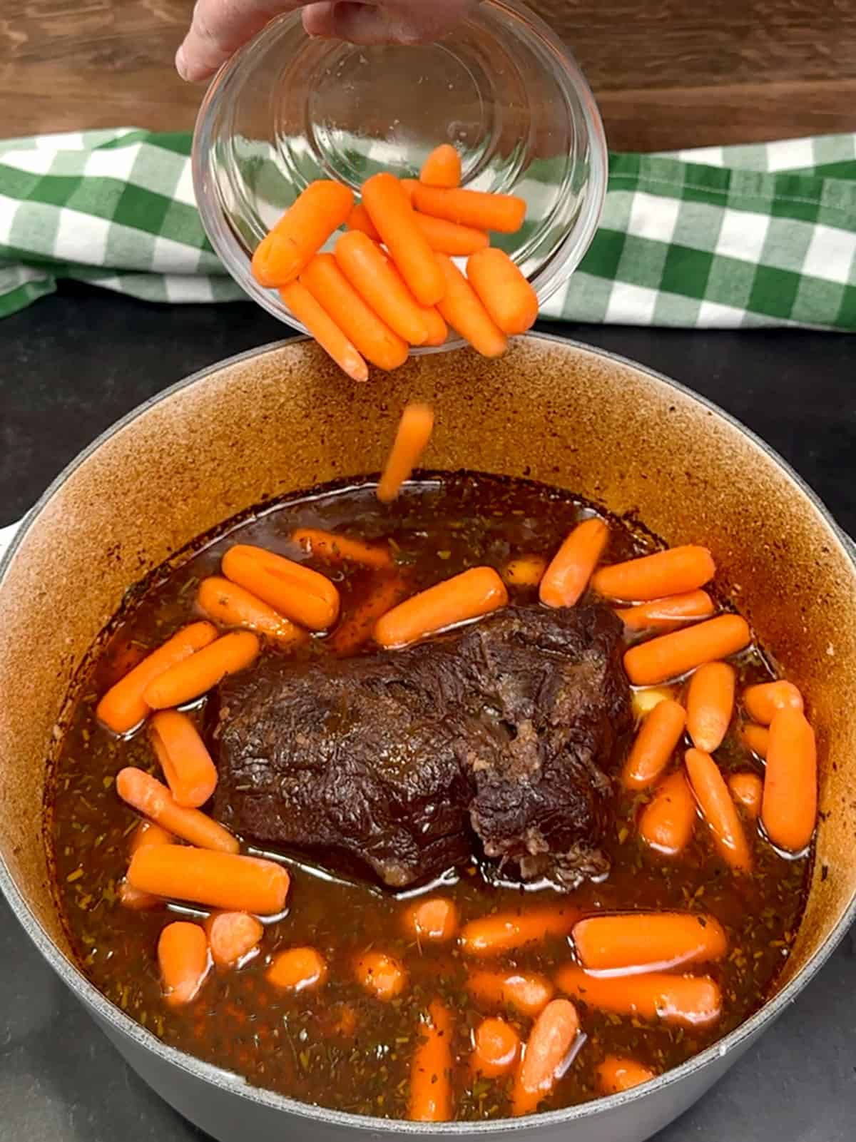 adding potatoes and carrots to the pot