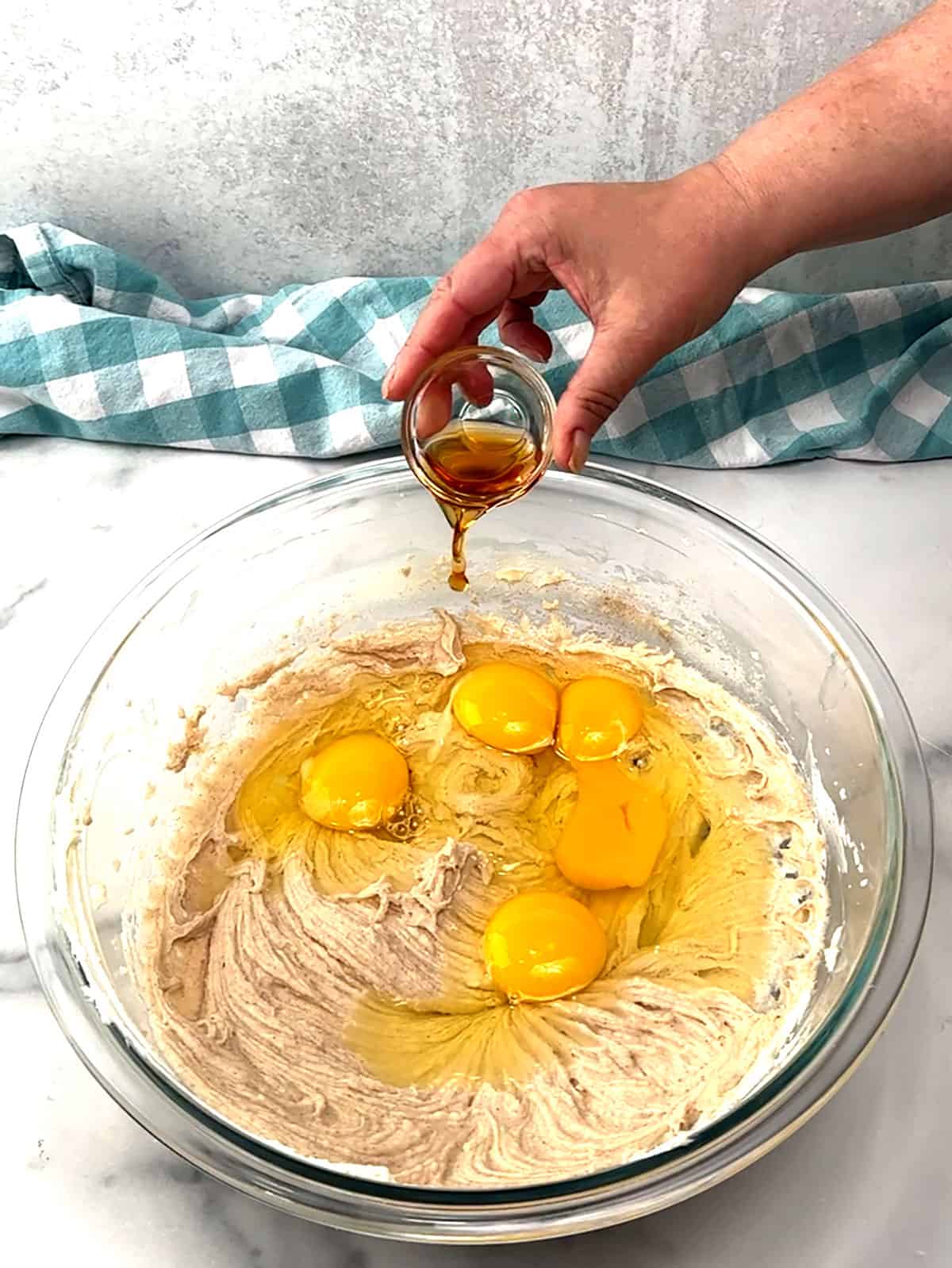 adding eggs and vanilla extract