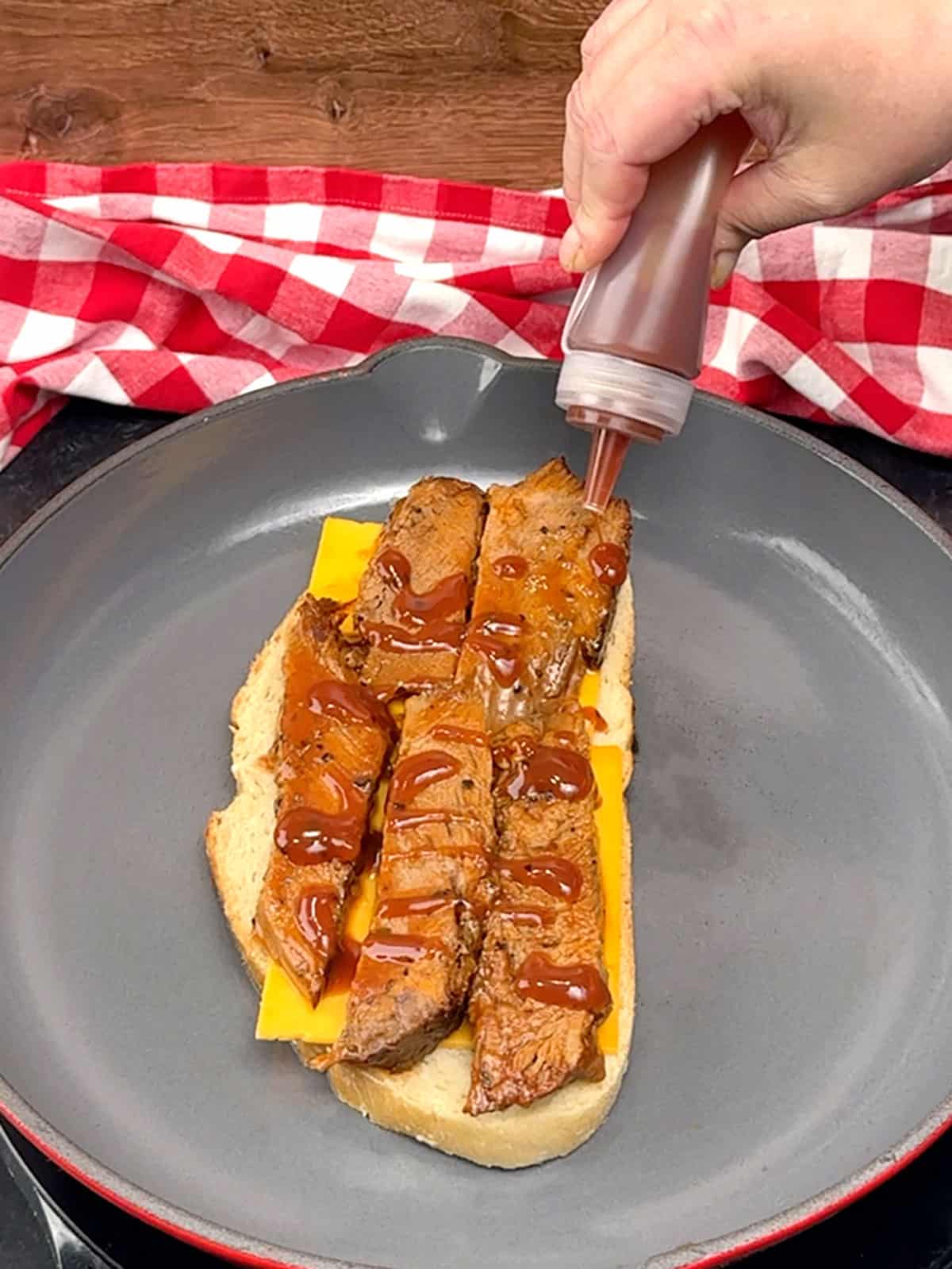 topping brisket with additional bbq sauce