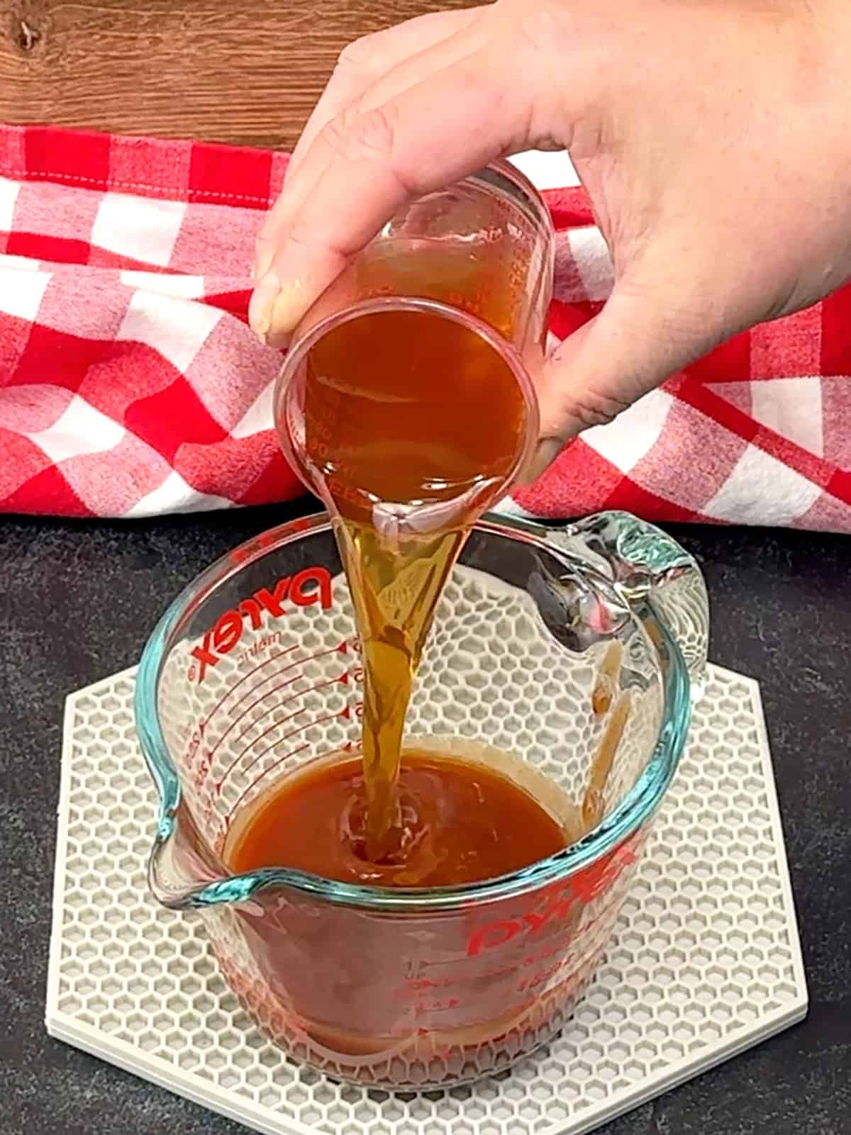 combining bbq sauce and beef broth
