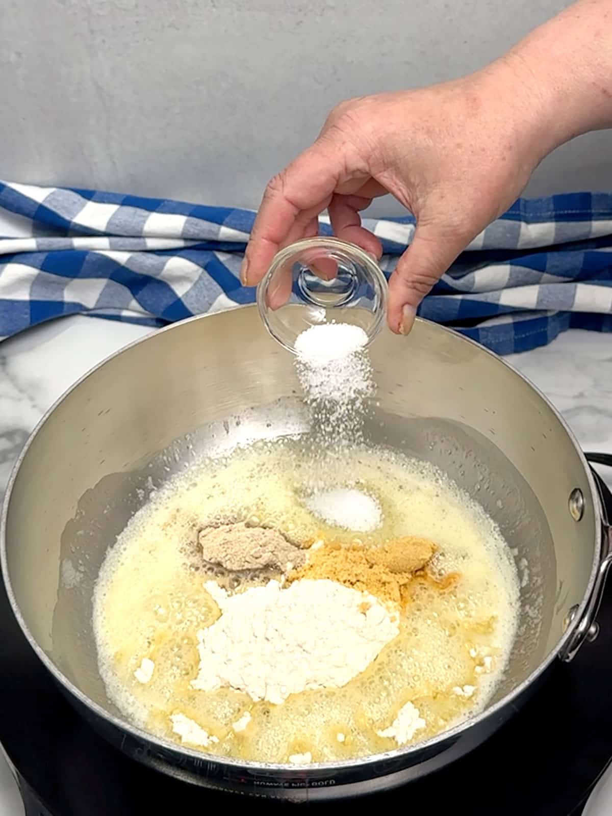 creating roux for Ultimate Baked Macaroni and Cheese with Ham