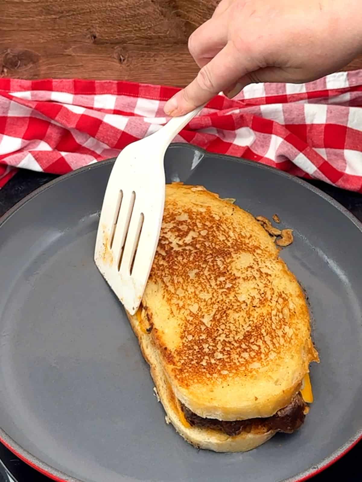 flipping Ultimate BBQ Brisket Melt Sandwich