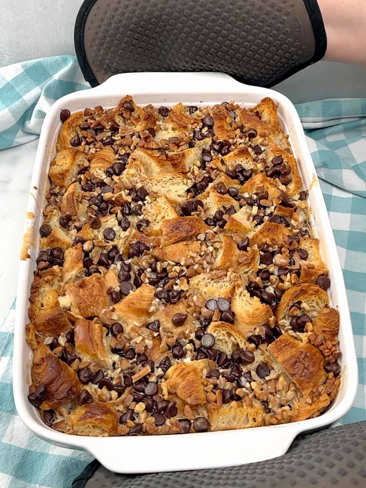 removing the Easy Chocolate Pecan Croissant Casserole from the oven