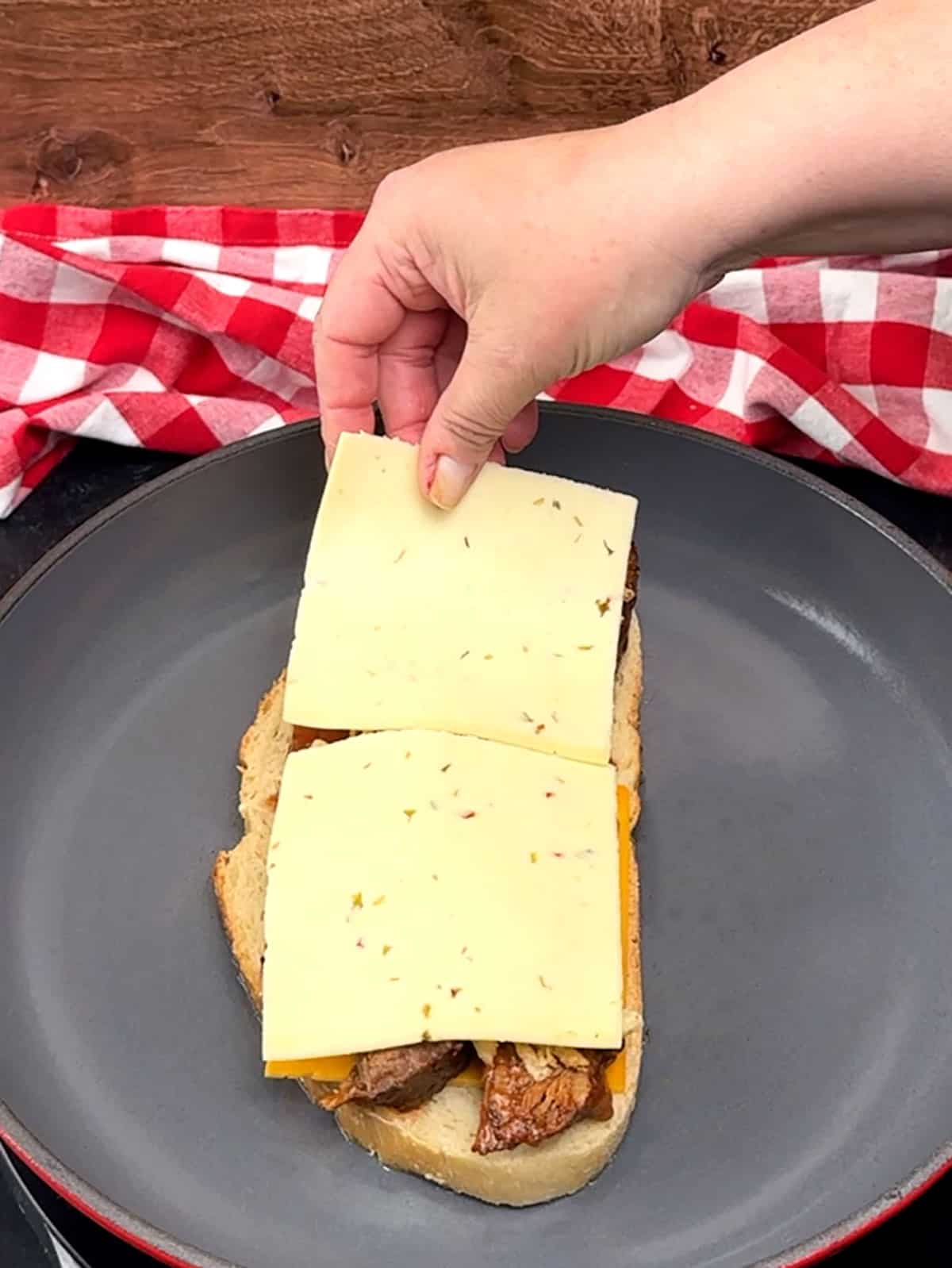pepper jack cheese on top of fried onions